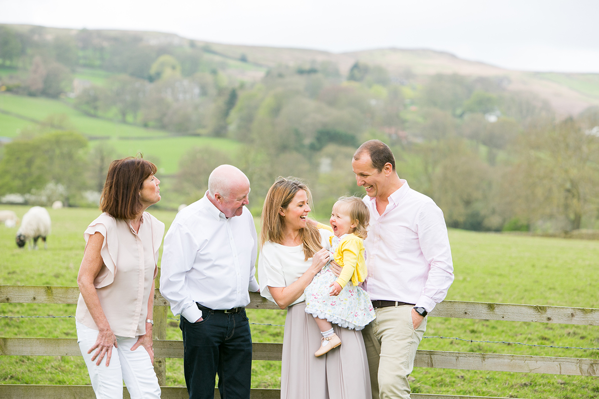 Colour photograph of Mum, Daughter, Dad and Grandparents on a family photoshoot Leeds