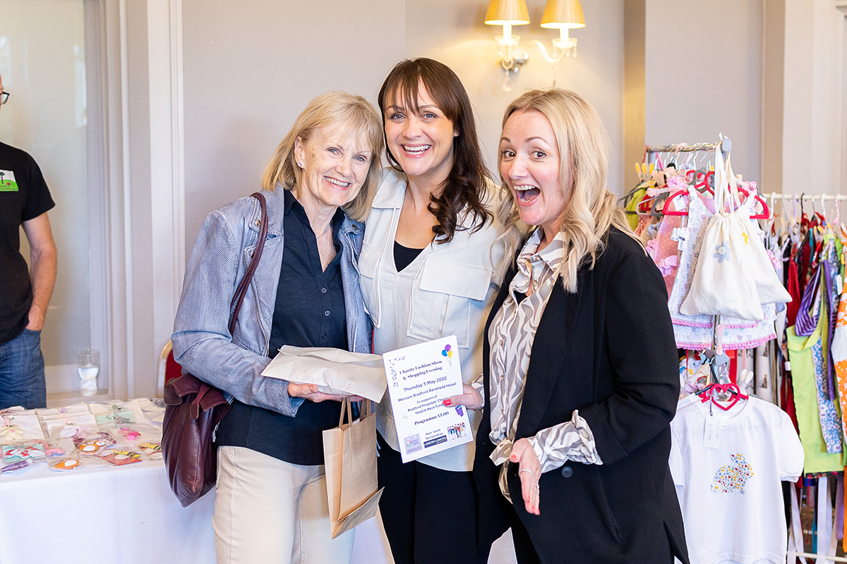 ladies at a charity event laughing