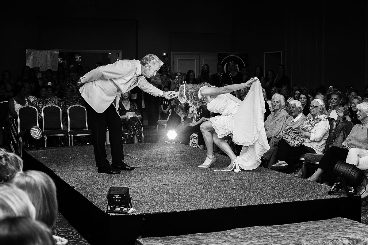 couple on catwalk dressed as bride and groom